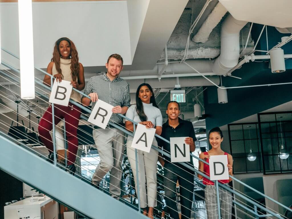 Designer presenting brand identity color palette and typography to clients