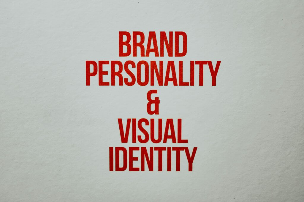 "Modern brand identity logo design concept on stationery and digital screens"